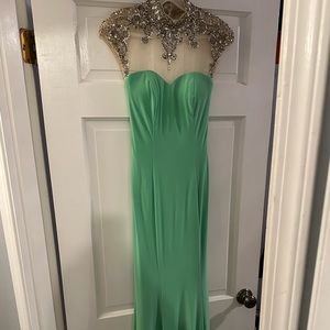 Green mermaid gown. Open back. Embellished neck line. Size 0. Worn once for prom